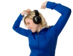 Young woman dancing in headphones