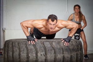 © Tom861 | Dreamstime.com - Push Up On A Tire Crossfit Training Photo